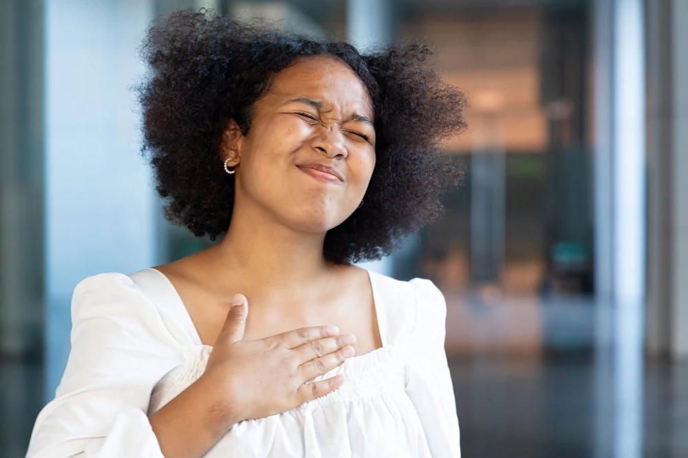 woman with acid reflux or gerd symptoms, acidic esophageal sickness