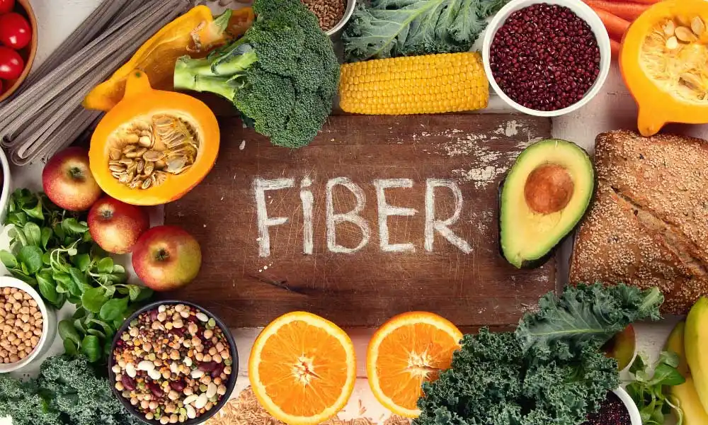 Chopping board with healthy food around it