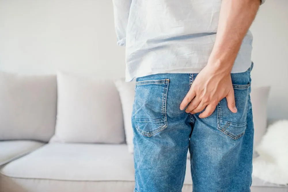 Man feeling in pain of hemorrhoid