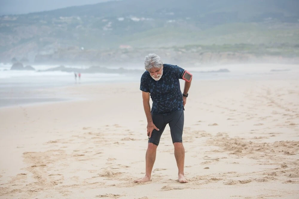 Man struggling to stay upright