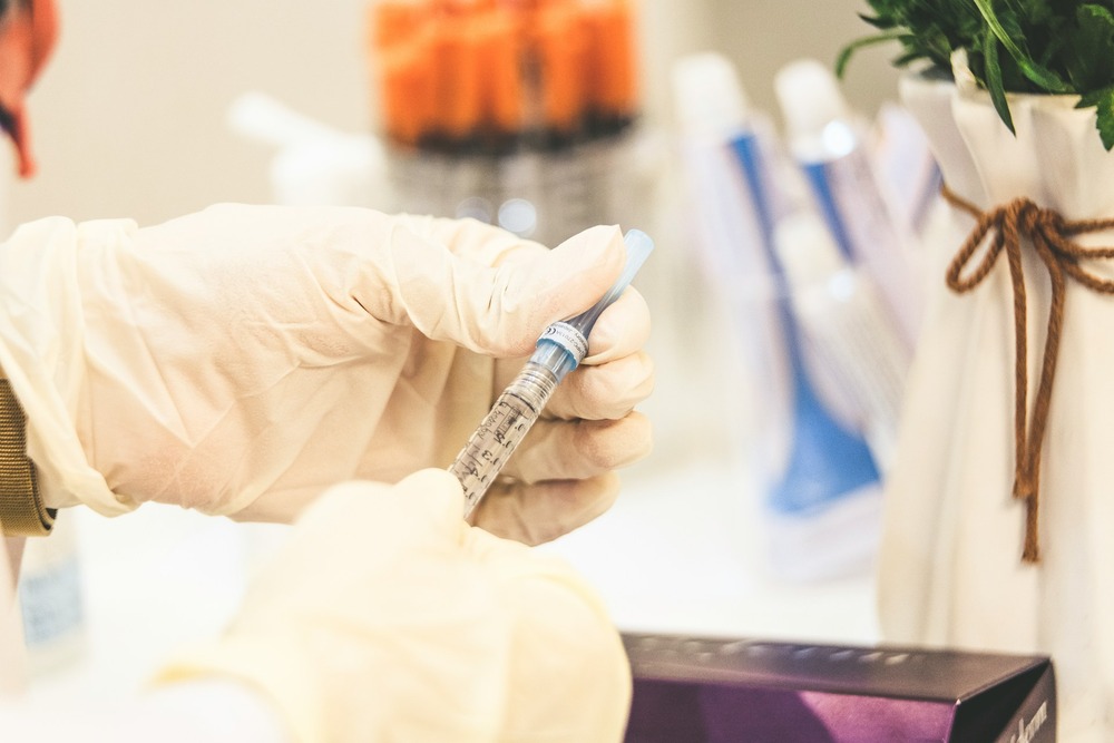 Doctor holding a syringe