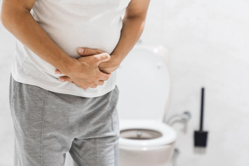 Men have stomachache and use their hands to hold their stomach In the bathroom