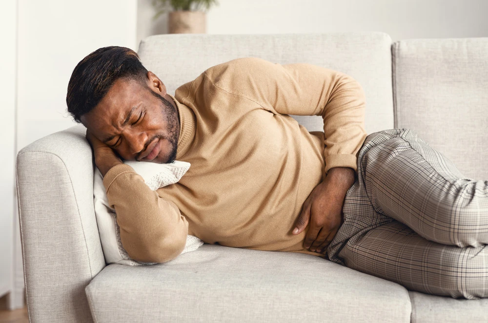 Man Suffering From Abdominal Pain