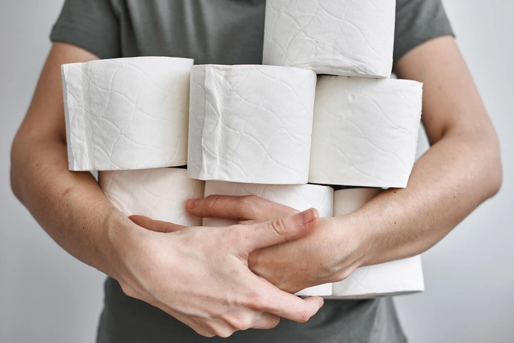 People are stocking up toilet paper for home quarantine from coronavirus.
