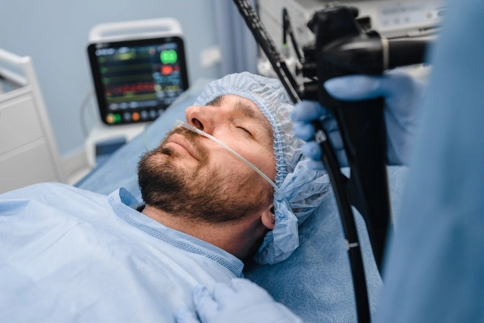 Male patient lying on the operating table under anesthesia
